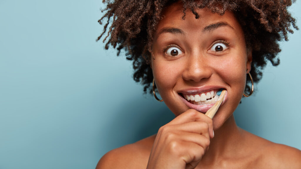 a woman brushing her teeth